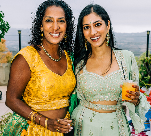 Rasta Rita serves alcohol at events with drink hand